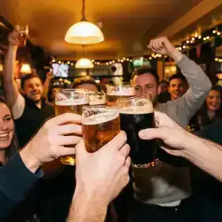 People clinking glasses in celebration